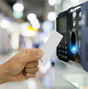 Employee scanning into time clock