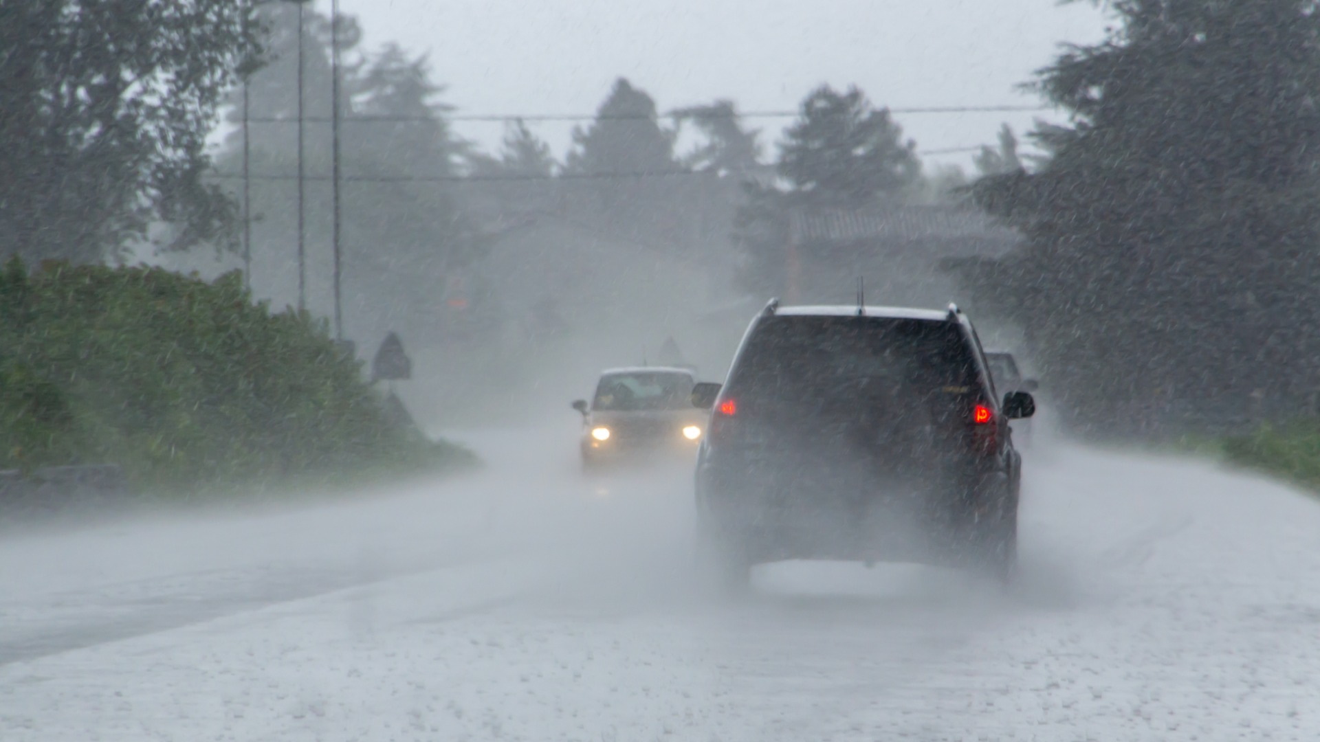 cars driving in the rain