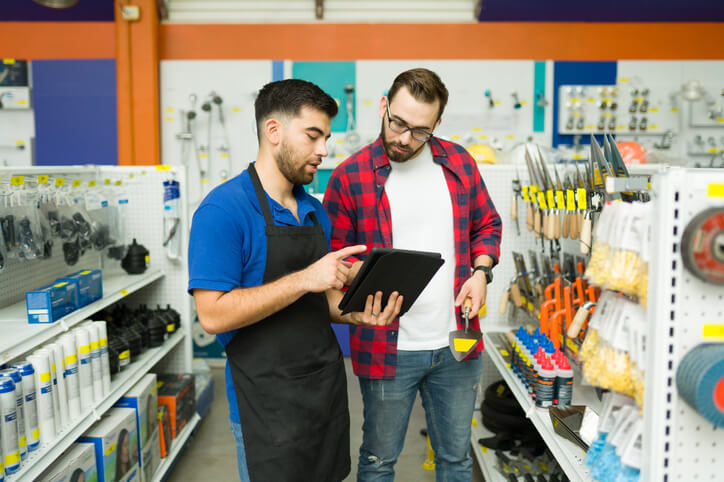 two men looking at tablet in hardware store